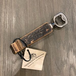 Retired wine barrel bottle opener